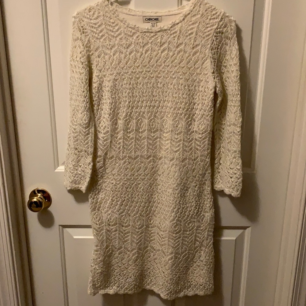 Shimmering holiday dress cream lined expect in arms unlined.